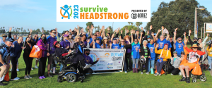Brain Injury survivors, caretakers, family, and friends celebrating at the surviveHEADSTRONG 2023 walk for recovery event