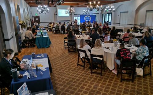 Symposium Keynote and Panelist Segment with Exhibitor tables